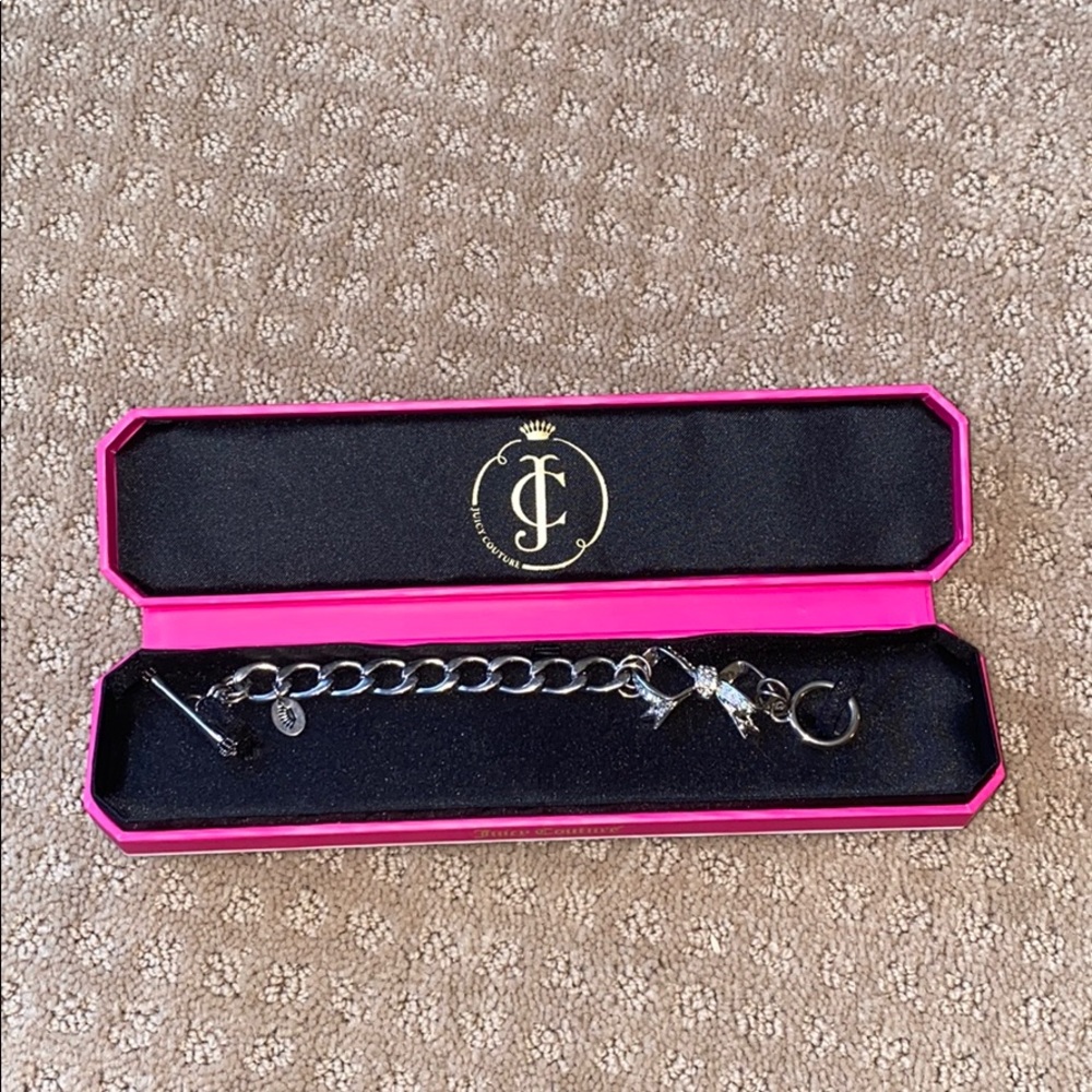 Silver Juicy Couture Charm bracelet with bow.